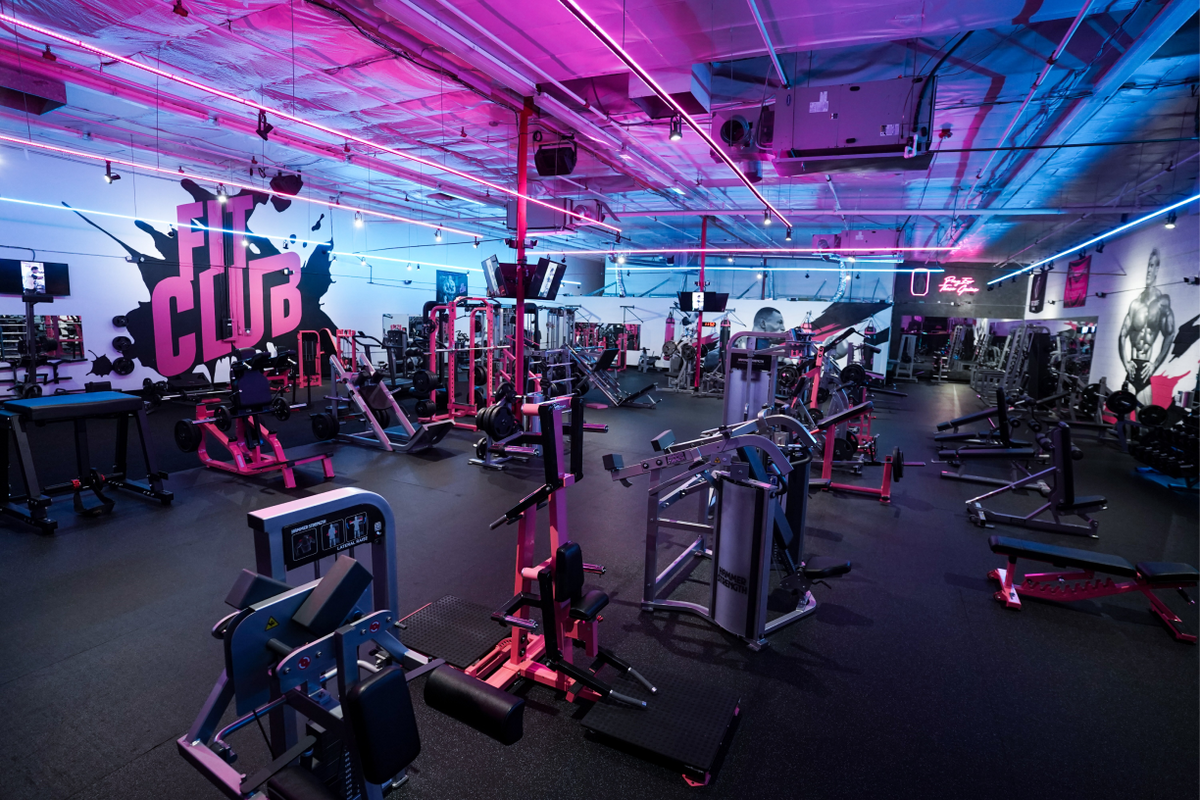 Fit Club Las Vegas gym with pink equipment and neon lighting